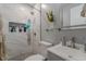 Modern bathroom with a glass-enclosed shower, mosaic floor, and floating shelves at 5510 Chelsea Rd, Indianapolis, IN 46241