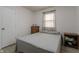 Bedroom featuring a bed, wood floors, a window, and a chest of drawers at 5510 Chelsea Rd, Indianapolis, IN 46241