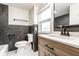 Updated bathroom with modern fixtures, a sleek vanity, and stylish tiling for a luxurious feel at 5516 S Randolph St, Indianapolis, IN 46227