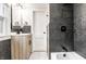 Renovated bathroom with a stylish vanity, modern fixtures, and a relaxing shower/tub combination at 5516 S Randolph St, Indianapolis, IN 46227