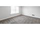 Bright bedroom with natural light, featuring fresh paint, new carpet, and comfortable living at 5516 S Randolph St, Indianapolis, IN 46227