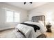 Comfortable bedroom with stylish decor, natural light, and a ceiling fan at 5516 S Randolph St, Indianapolis, IN 46227
