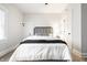 Inviting bedroom with a neutral color scheme, plush bedding, and a ceiling fan at 5516 S Randolph St, Indianapolis, IN 46227