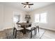Elegant dining room featuring a rustic wood table, comfortable seating, and a modern light fixture at 5516 S Randolph St, Indianapolis, IN 46227