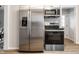 Stainless steel refrigerator, microwave, and oven in a modern, updated kitchen at 5516 S Randolph St, Indianapolis, IN 46227