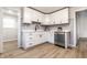 Charming kitchen featuring updated white cabinets and stainless steel dishwasher at 5516 S Randolph St, Indianapolis, IN 46227