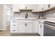 Bright kitchen with white cabinets, quartz countertops, black hardware, and open shelving at 5516 S Randolph St, Indianapolis, IN 46227