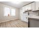 Eat-in kitchen featuring white cabinets, quartz countertops, and stainless steel appliances at 5516 S Randolph St, Indianapolis, IN 46227
