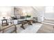 Elegant living room with plush seating, staircase, and stylish decor creating a cozy retreat at 5516 S Randolph St, Indianapolis, IN 46227