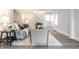 Comfortable living room with a gray sofa, soft rug, and stylish armchairs at 5516 S Randolph St, Indianapolis, IN 46227