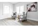 Cozy sitting area with comfortable chairs, wood-look floors, and ample natural light at 5516 S Randolph St, Indianapolis, IN 46227