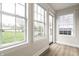 Bright sunroom with large windows offering abundant natural light and views of the outdoors at 5516 S Randolph St, Indianapolis, IN 46227