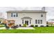 Back of home with patio area including built-in grill and outdoor seating at 559 Hythe Way, Westfield, IN 46074