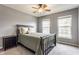 Well-lit bedroom with windows, ceiling fan, and modern decor creating a relaxing atmosphere at 559 Hythe Way, Westfield, IN 46074