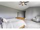 Comfortable bedroom featuring a ceiling fan, carpeted floor and a decorative chair at 559 Hythe Way, Westfield, IN 46074