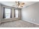 Cozy bedroom with natural light from two windows and a ceiling fan for added comfort at 559 Hythe Way, Westfield, IN 46074