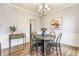 Dining room with wood floors and modern lighting at 559 Hythe Way, Westfield, IN 46074
