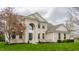 Charming two-story home features a brick facade, arched window, manicured lawn, and mature trees at 559 Hythe Way, Westfield, IN 46074