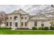 Two-story brick home featuring a manicured lawn and arched entryway with large windows at 559 Hythe Way, Westfield, IN 46074