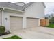 Attached two-car garage with concrete driveway and landscaped surroundings at 559 Hythe Way, Westfield, IN 46074