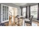 Sunlit home office with hardwood floors, French doors, modern desk and comfortable seating at 559 Hythe Way, Westfield, IN 46074