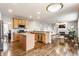 Open concept kitchen with stainless steel appliances, granite countertops, and hardwood flooring at 559 Hythe Way, Westfield, IN 46074
