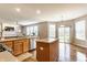 Modern kitchen with an island, stainless steel appliances, and a view to the backyard at 559 Hythe Way, Westfield, IN 46074