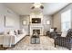 Stylish living room featuring a fireplace, hardwood floors, and comfortable seating at 559 Hythe Way, Westfield, IN 46074