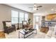 Open-concept living room with hardwood floors, plenty of natural light, and stylish furniture at 559 Hythe Way, Westfield, IN 46074