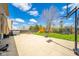 Spacious patio featuring a picnic table, grill, trampoline, and playset at 5820 Marble Ct, Anderson, IN 46013