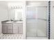 Bathroom with dual sink vanity and glass enclosed shower at 5820 Marble Ct, Anderson, IN 46013