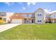 Two-story home with a brick-accented garage and a well-maintained lawn on a sunny day at 5820 Marble Ct, Anderson, IN 46013