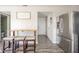 Kitchen featuring stainless steel refrigerator, eat-in table, and updated flooring at 5820 Marble Ct, Anderson, IN 46013