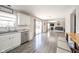 Open floor plan showcasing the kitchen, living room with fireplace, and hardwood flooring at 5820 Marble Ct, Anderson, IN 46013