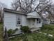 Shows a single story home with peeling paint and aging features at 5842 Greenfield Ave, Indianapolis, IN 46219