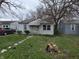 Modest single story home with a small yard and walkway at 5842 Greenfield Ave, Indianapolis, IN 46219