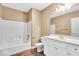 A clean bathroom has a shower, toilet, and a white vanity at 5861 Dawnwood Dr, Carmel, IN 46033