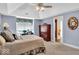 Bedroom with vaulted ceiling offers dresser storage and an ensuite bathroom at 5861 Dawnwood Dr, Carmel, IN 46033