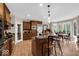 Spacious kitchen boasts an island, stainless steel appliances, and a breakfast nook with scenic views at 5861 Dawnwood Dr, Carmel, IN 46033