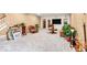 Spacious living room featuring neutral walls, plush carpet, and a built-in entertainment center with a television at 5861 Dawnwood Dr, Carmel, IN 46033