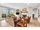Comfortable living room featuring a fireplace, built-in shelving, and access to the deck at 5861 Dawnwood Dr, Carmel, IN 46033