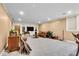 Basement living room with a TV, couch, built-in storage and wet bar at 5861 Dawnwood Dr, Carmel, IN 46033