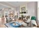 Elegant living room boasts hardwood floors, fireplace, and comfortable seating area at 5861 Dawnwood Dr, Carmel, IN 46033