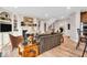 Inviting living room with fireplace, built-ins, and hardwood floors leading to other rooms at 5861 Dawnwood Dr, Carmel, IN 46033