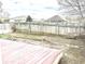 Fenced backyard with wooden fence and small brick patio area at 607 Deer Trail Dr, Indianapolis, IN 46217