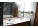 Bathroom features a dual vanity and a large mirror with plenty of lighting at 607 Deer Trail Dr, Indianapolis, IN 46217