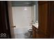 The bathroom includes a shower-tub, tile flooring, and wooden cabinets at 607 Deer Trail Dr, Indianapolis, IN 46217