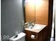 Bathroom with outdated fixtures and a light blue paint at 607 Deer Trail Dr, Indianapolis, IN 46217