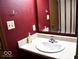 Bathroom with a light countertop and burgundy walls at 607 Deer Trail Dr, Indianapolis, IN 46217