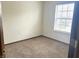 This bedroom boasts neutral walls, carpet flooring, and a window, making it a relaxing and inviting space at 607 Deer Trail Dr, Indianapolis, IN 46217